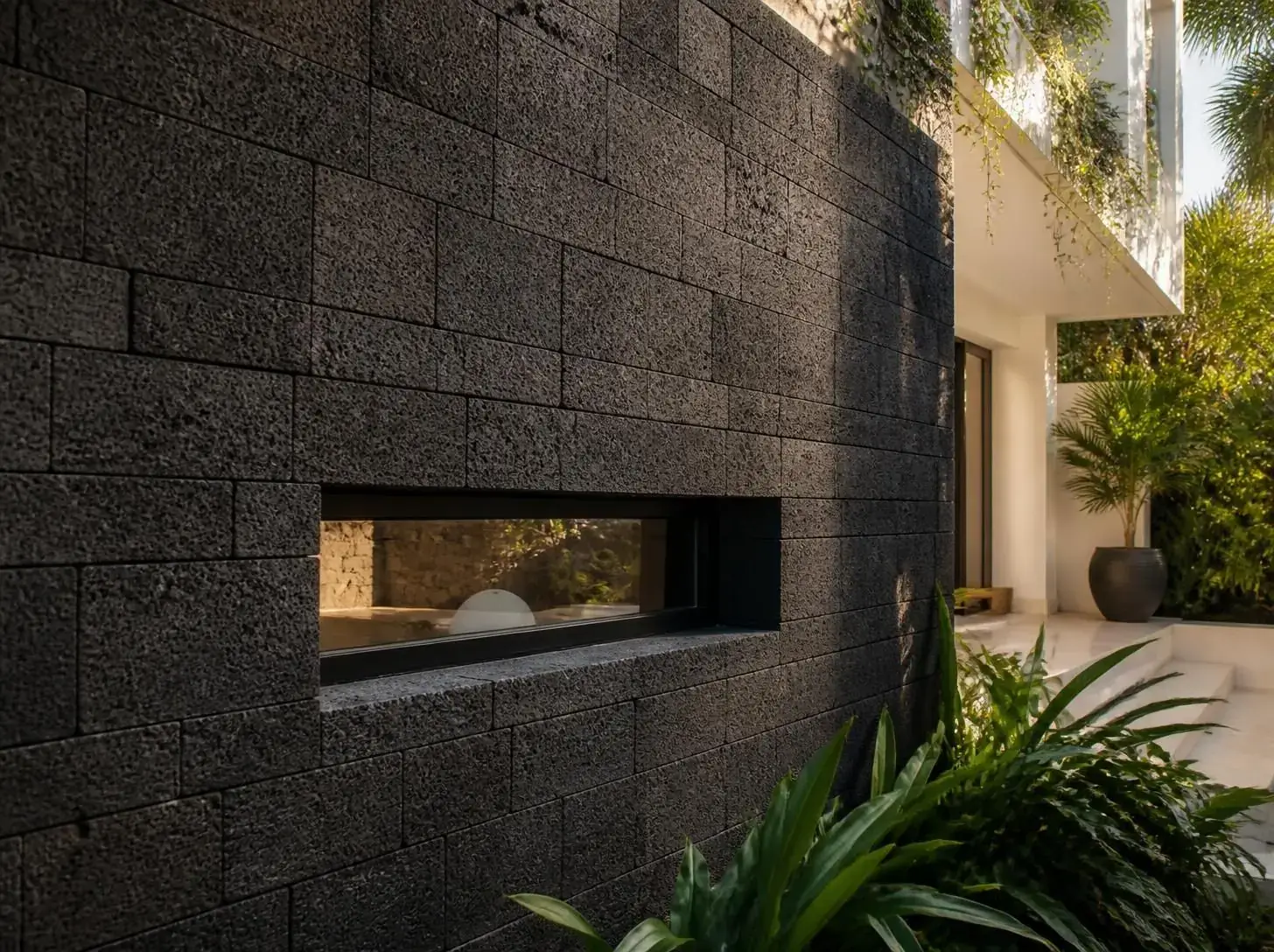 Black lava stone wall cladding on a contemporary facade