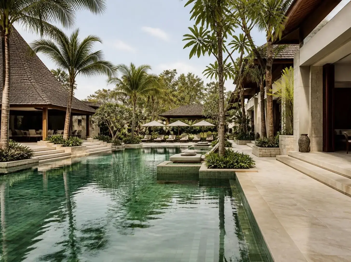 Resort landscape with natural stone paving and pool