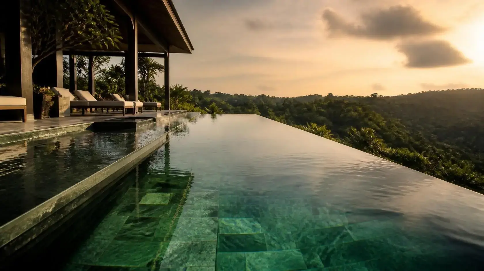 Infinity edge pool in Sukabumi Green Stone at sunset over hills