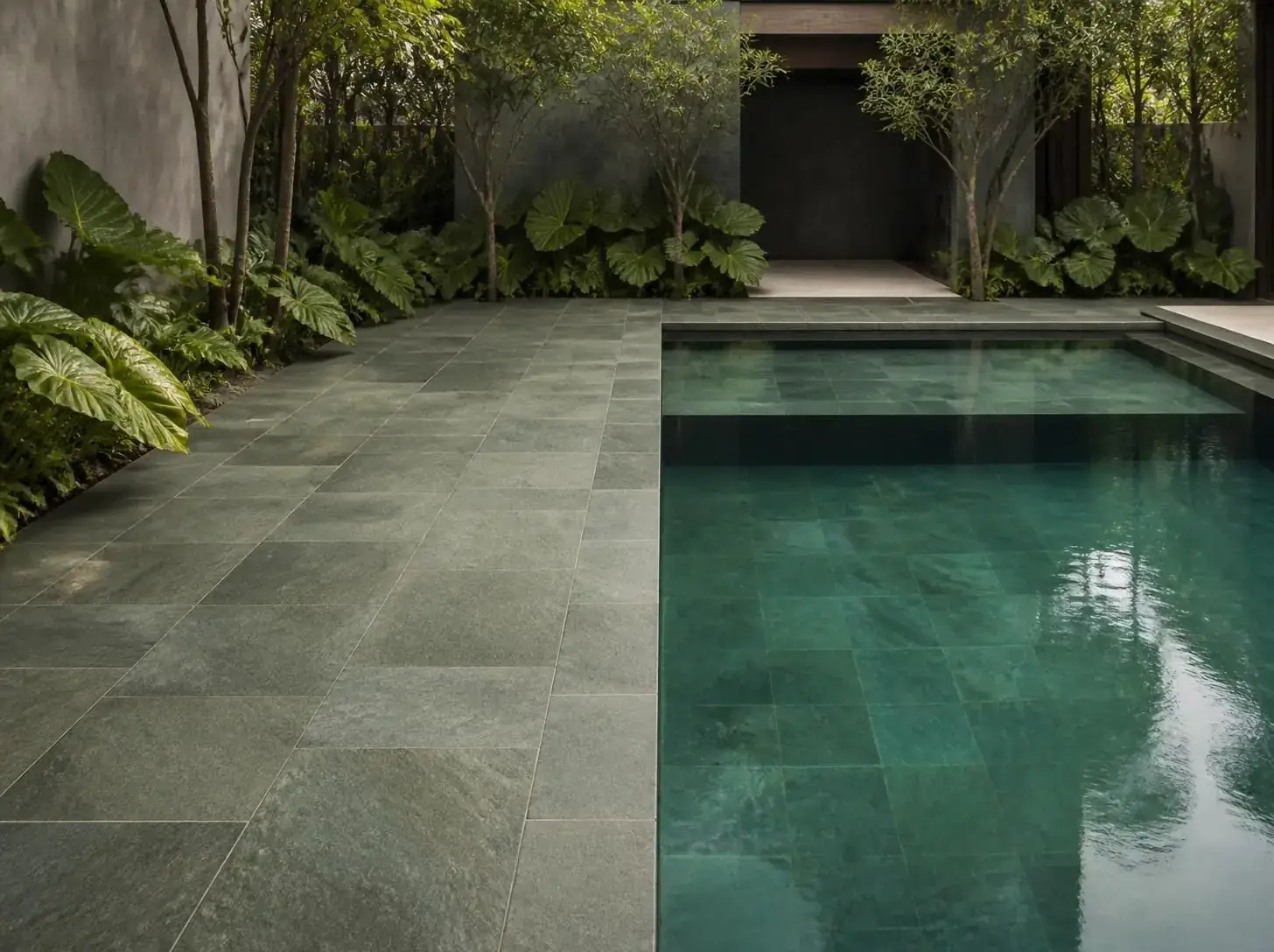Stone pool deck in a courtyard